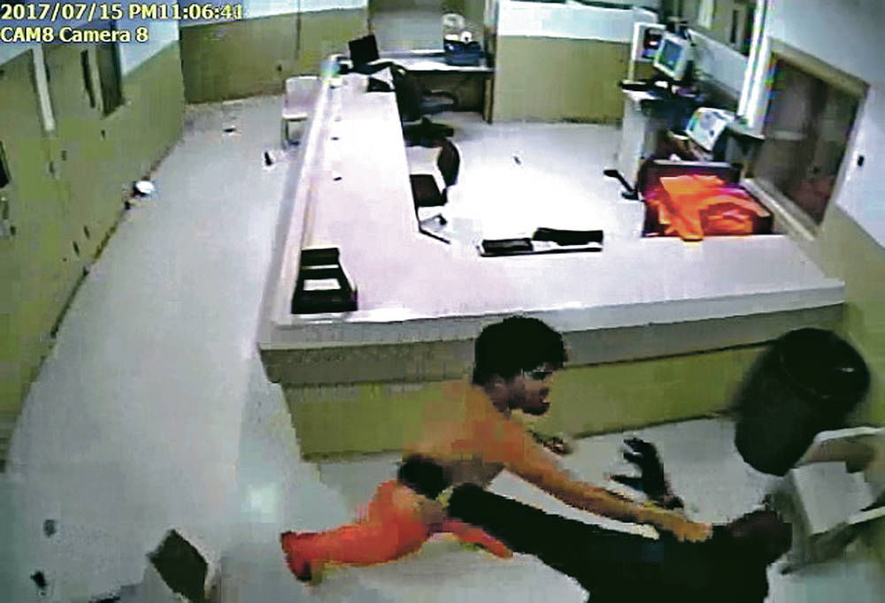Suspect in 5 murders roams jail, attacks guards before being subdued